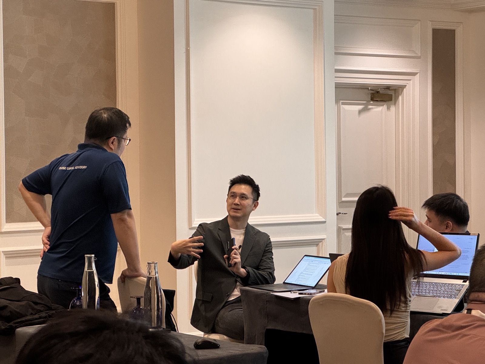 A Nexor AI trainer answering a participant's question during a hands-on session