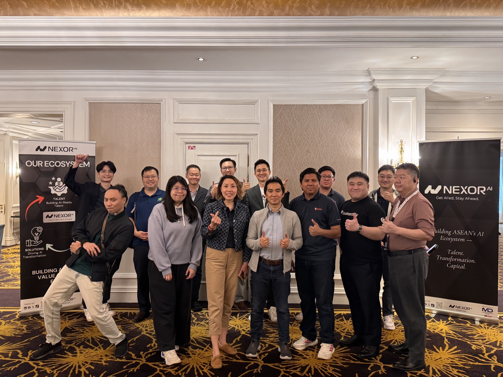 Participants and the Nexor AI team posing together in front of Nexor AI banners after a training session